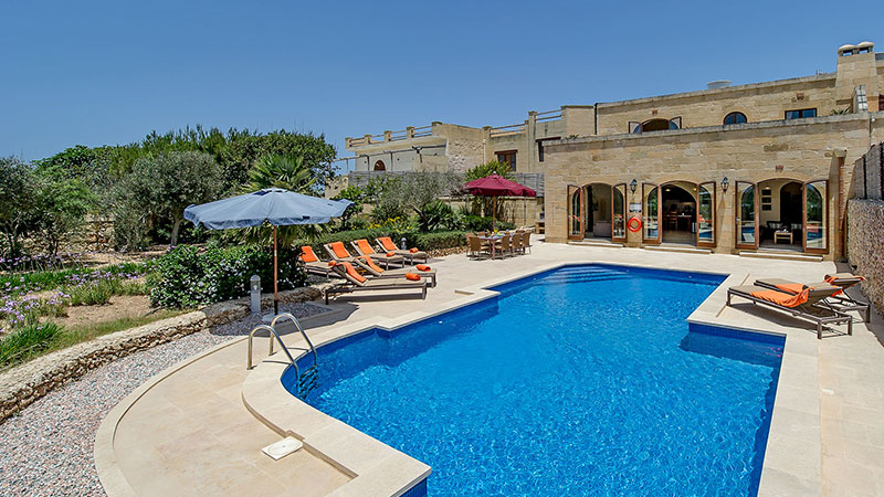 Image of villas pool with villas in the background